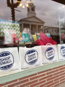 The storefront window display at River Reader Bookstore in Lexington, MO, shows that they mean business this Saturday.